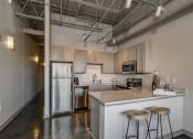 Thumbnail 6 of 41 - Gourmet Kitchen With Island at The Tower Apartments, Tuscaloosa, 35401