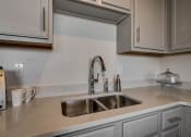 Thumbnail 19 of 41 - Stainless Steel Sink With Faucet In Kitchen at The Tower Apartments, Alabama