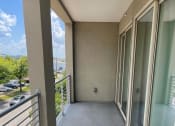 Thumbnail 17 of 29 - Large balcony with sliding doors at Flats on 4th Apartments in Birmingham, AL