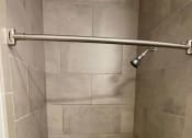 Thumbnail 11 of 29 - Tiled walk-in showers at Flats on 4th Apartments in Birmingham, AL