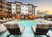 Thumbnail 19 of 38 - Pool and Sundeck at Tapestry Bocage Apartments in Baton Rouge, LA