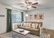 Thumbnail 1 of 24 - Living room with ceiling fan at Retreat at Brightside Apartments in Baton Rouge, LA