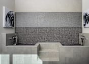 Thumbnail 8 of 22 - A bathroom with a grey tiled shower area and a grey sink.