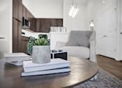 Thumbnail 51 of 55 - A living room with high ceilings, luxury LVP flooring, bright lights and storage