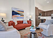 Thumbnail 6 of 55 - A living room with high ceilings, luxury LVP flooring and natural light