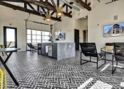 Thumbnail 35 of 55 - a lobby with a reception desk at Artisan Flats Apartments in Birmingham, AL