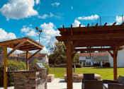 Thumbnail 20 of 32 - Grilling station and pergola at Ascent Jones Apartments in Huntsville, Alabama