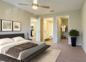 Thumbnail 28 of 34 - a bedroom with a bed and a ceiling fan
