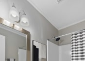 Thumbnail 10 of 22 - a bathroom with a sink toilet and bathtub  Living Room with wood flooring at Midtown Oaks Townhomes in Mobile, AL