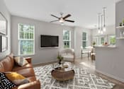 Thumbnail 3 of 22 - A living room with a brown leather couch and a white armchair.