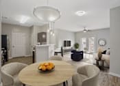 Thumbnail 5 of 22 - A modern living room with a dining table and chairs.