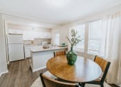 Thumbnail 12 of 22 - white kitchen with stone countertops at Midtown Oaks Townhomes in Mobile, AL