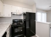 Thumbnail 8 of 32 - Updated Kitchen With Black Appliances at Arbor Pointe at Hillcrest, Little Rock, 72205