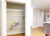 Thumbnail 5 of 25 - a before and after picture of an empty pantry in a kitchen