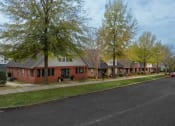 Thumbnail 25 of 28 - a row of houses on the side of a street
