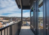 Thumbnail 24 of 55 - a view of the city from a balcony of a building at Artisan Flats in Birmingham, AL