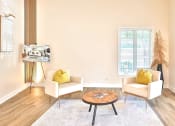 Thumbnail 19 of 25 - a living room with two chairs and a coffee table
