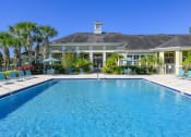 Thumbnail 2 of 33 - a large swimming pool in front of a house
