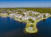 Thumbnail 33 of 33 - an aerial view of houses on the water near a lake