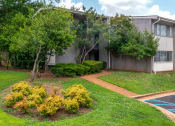 Thumbnail 24 of 31 - lush landscaping at Malibu at Martin Apartments in Huntsville, Alabama