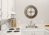 Thumbnail 8 of 31 - White kitchen at Malibu at Martin Apartments in Huntsville, Alabama