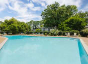 Thumbnail 22 of 31 - Pool and chairs at Malibu at Martin Apartments in Huntsville, Alabama
