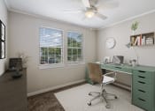 Thumbnail 15 of 22 - bedrooms with natural light and ceiling fans  Living Room with wood flooring at Midtown Oaks Townhomes in Mobile, AL