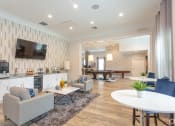 Thumbnail 13 of 21 - a clubroom with a table and chairs and a television