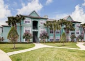 Thumbnail 33 of 35 - Building Exterior and Green Space at Bermuda Estates Apartments in Ormond Beach, FL