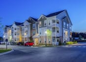 Thumbnail 20 of 21 - a large apartment building with a street in front of it