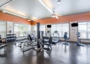 Thumbnail 13 of 21 - a room filled with lots of different types of exercise equipment
