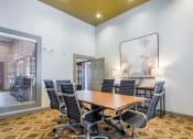 Thumbnail 14 of 21 - a conference room with a table and chairs