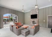 Thumbnail 16 of 21 - a living room filled with furniture and a flat screen tv