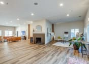 Thumbnail 21 of 25 - the living room has a fireplace and wood flooring