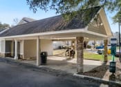 Thumbnail 20 of 34 - a gas station with a covered parking lot at 10X Audubon Park apartments in Daphne, AL 