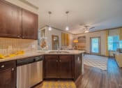Thumbnail 5 of 21 - a kitchen with a sink and a counter top