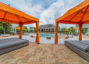 Thumbnail 11 of 21 - our apartments have a pool and cabanas with orange umbrellas