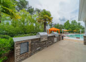 Thumbnail 17 of 21 - the preserve at ballantyne commons concierge desk and pool area with trees