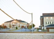 Thumbnail 22 of 25 - a volleyball net in the middle of a street
