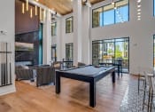 Thumbnail 26 of 50 - resident social lounge with pool table at Tapestry Overbrook in McDonough, Georgia