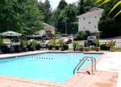 Thumbnail 11 of 18 - a swimming pool in the middle of a neighborhood