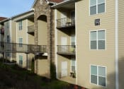 Thumbnail 18 of 18 - a building with two balconies and a street sign on it