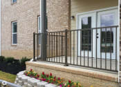 Thumbnail 9 of 18 - a house with a balcony and a brick wall