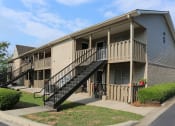 Thumbnail 1 of 29 - the exterior of an apartment building with stairs and balconies