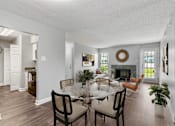 Thumbnail 1 of 26 - Open living and dining area with fireplace at Mirabelle Apartments in Mobile, Alabama