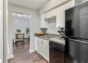 Thumbnail 3 of 26 - Renovated kitchen at Mirabelle Apartments in Mobile, Alabama