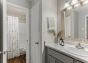 Thumbnail 8 of 24 - a bathroom with a shower and a sink