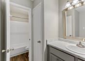 Thumbnail 23 of 24 - a bathroom with a toilet and a sink