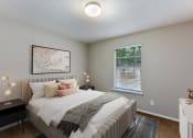 Thumbnail 5 of 24 - a bedroom with a large bed and two night stands with lamps on them