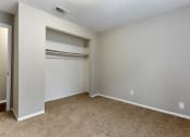 Thumbnail 20 of 24 - a bedroom with a closet and an open door